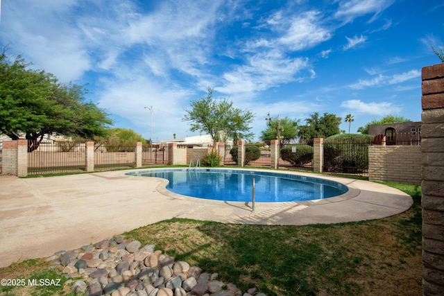 1238 S Camino Seco, Tucson, AZ 85710 - view of swimming pool featuring a fenced backyard and a patio
