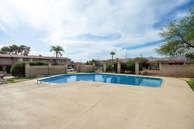 1238 S Camino Seco, Tucson, AZ 85710 - community pool with a patio area