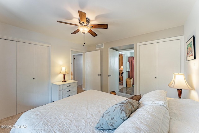 303 S Paseo Cerro Unit A, Green Valley, AZ 85614 - carpeted bedroom featuring multiple closets and ceiling fan