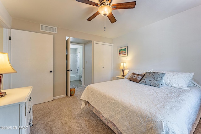 303 S Paseo Cerro Unit A, Green Valley, AZ 85614 - bedroom featuring light colored carpet, ensuite bath, and ceiling fan