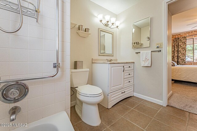 303 S Paseo Cerro Unit A, Green Valley, AZ 85614 - full bathroom featuring vanity, tile patterned flooring, toilet, ensuite bathroom, and baseboards
