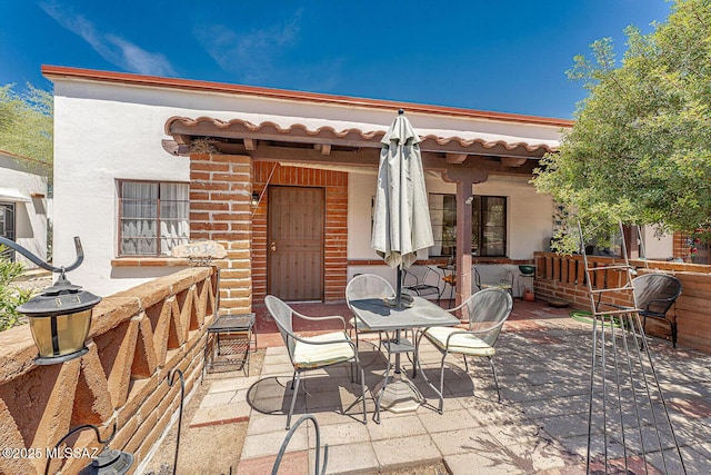 303 S Paseo Cerro Unit A, Green Valley, AZ 85614 - view of patio featuring outdoor dining area