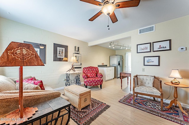 303 S Paseo Cerro Unit A, Green Valley, AZ 85614 - living area with ceiling fan, light wood-style floors, and rail lighting