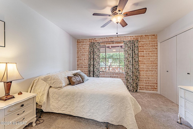 303 S Paseo Cerro Unit A, Green Valley, AZ 85614 - bedroom featuring carpet flooring, a closet, brick wall, and ceiling fan