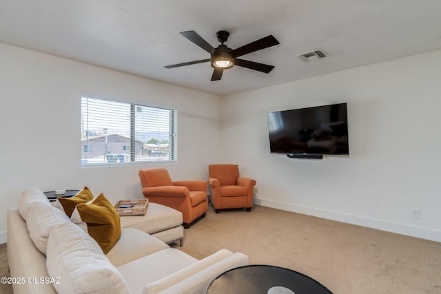 5762 E Helen St, Tucson, AZ 85712 - carpeted living area with a ceiling fan and baseboards