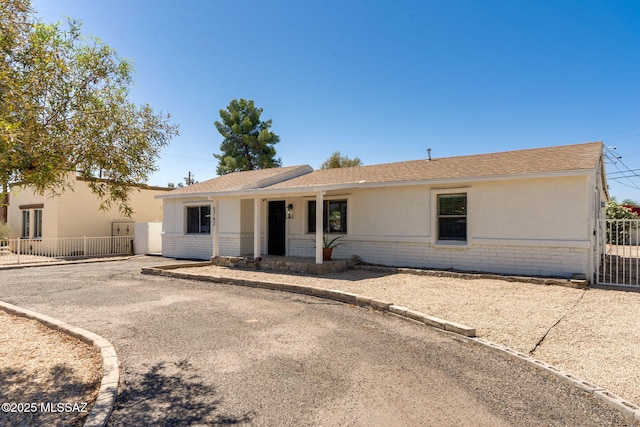 5762 E Helen St, Tucson, AZ 85712 - single story home with brick siding and a shingled roof