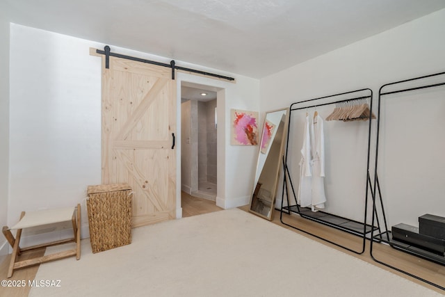 5762 E Helen St, Tucson, AZ 85712 - unfurnished bedroom featuring a barn door