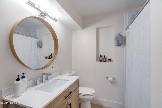 5762 E Helen St, Tucson, AZ 85712 - full bathroom with toilet, vanity, and baseboards