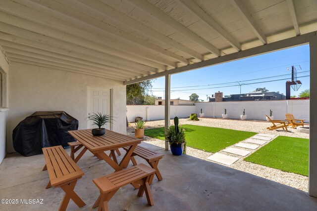 5762 E Helen St, Tucson, AZ 85712 - fenced backyard featuring a patio area, outdoor dining space, and a grill