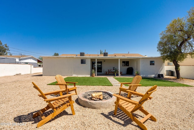 5762 E Helen St, Tucson, AZ 85712 - back of house featuring an outdoor fire pit, a patio area, and stucco siding