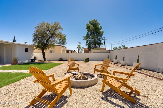 5762 E Helen St, Tucson, AZ 85712 - fenced backyard with a fire pit