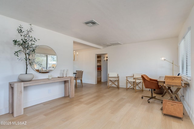 5762 E Helen St, Tucson, AZ 85712 - home office with wood finished floors, baseboards, and a chandelier