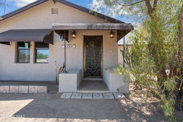 3420 N Los Altos Ave, Tucson, AZ 85705 - property entrance featuring stucco siding