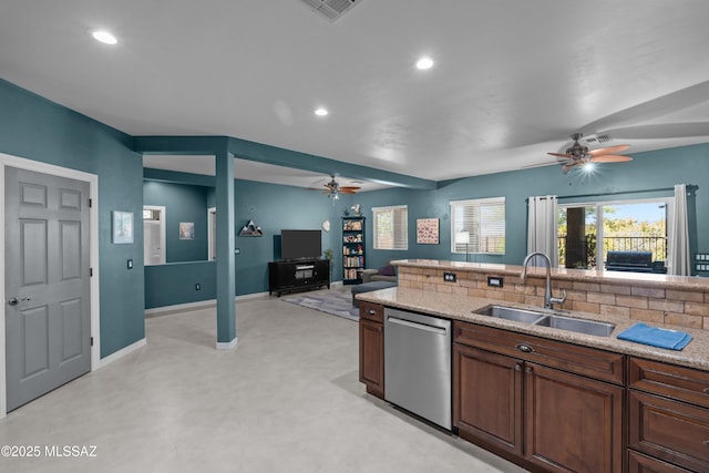 17213 S Mesa Shadows Dr, Vail, AZ 85641 - kitchen featuring stainless steel dishwasher, a ceiling fan, a sink, recessed lighting, and light stone countertops