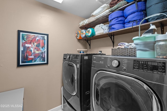 17213 S Mesa Shadows Dr, Vail, AZ 85641 - laundry room with washing machine and clothes dryer and baseboards
