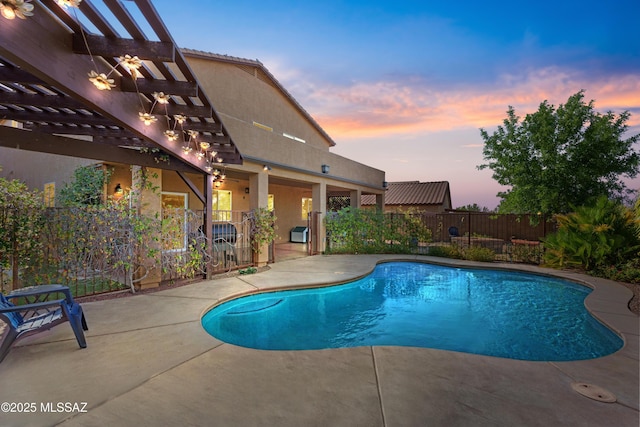 17213 S Mesa Shadows Dr, Vail, AZ 85641 - pool at dusk featuring a pergola and a patio area