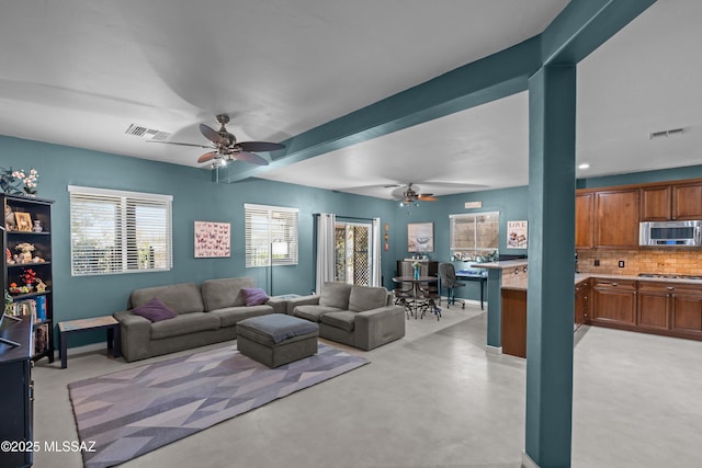 17213 S Mesa Shadows Dr, Vail, AZ 85641 - living area with a ceiling fan, finished concrete flooring, and baseboards