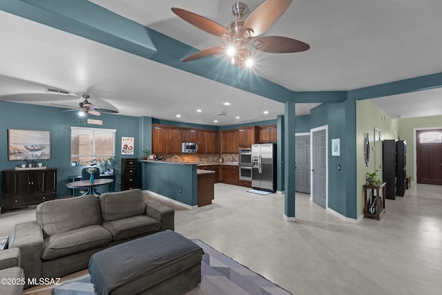 17213 S Mesa Shadows Dr, Vail, AZ 85641 - living room featuring a ceiling fan, recessed lighting, finished concrete floors, healthy amount of natural light, and baseboards