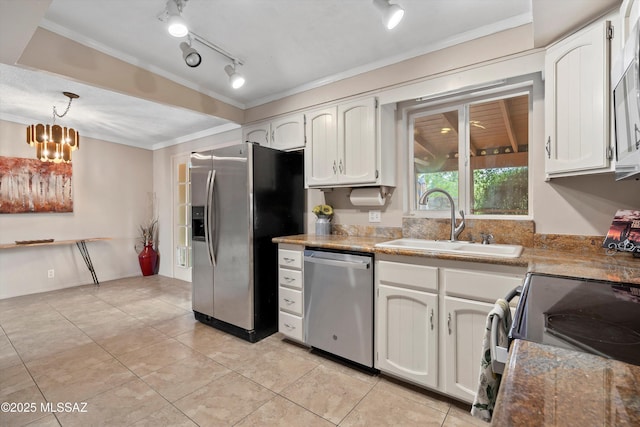 1709 S Avenida Sirio, Tucson, AZ 85710 - kitchen with stainless steel appliances, a sink, ornamental molding, white cabinets, and light tile patterned floors