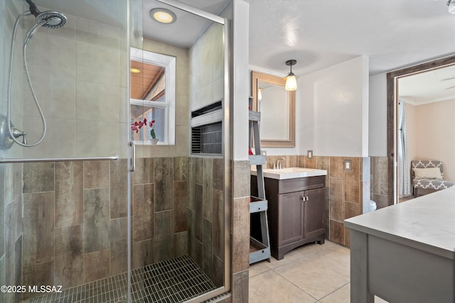 1709 S Avenida Sirio, Tucson, AZ 85710 - full bathroom featuring vanity, a shower stall, tile walls, and tile patterned floors