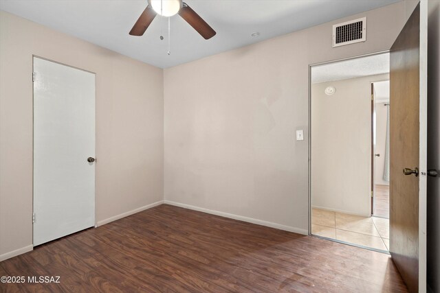 1709 S Avenida Sirio, Tucson, AZ 85710 - unfurnished room with ceiling fan, wood finished floors, baseboards, and a smoke detector
