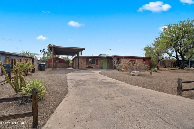 1709 S Avenida Sirio, Tucson, AZ 85710 - view of front of house featuring concrete driveway and brick siding