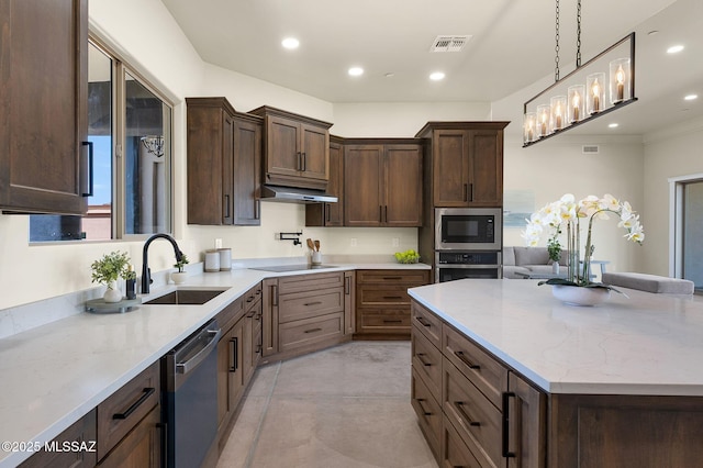 976 W Las Lomitas Rd, Tucson, AZ 85704 - kitchen with stainless steel appliances, light stone countertops, dark brown cabinetry, pendant lighting, and recessed lighting