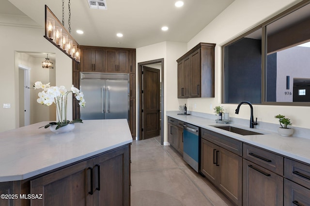 976 W Las Lomitas Rd, Tucson, AZ 85704 - kitchen featuring dishwashing machine, built in fridge, dark brown cabinetry, recessed lighting, and finished concrete floors
