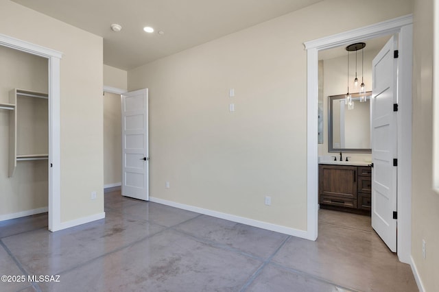 976 W Las Lomitas Rd, Tucson, AZ 85704 - unfurnished bedroom with finished concrete floors, recessed lighting, a walk in closet, connected bathroom, and a closet