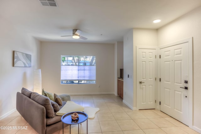 1500 E Pusch Wilderness Dr Unit 10106, Tucson, AZ 85737 - living area featuring light tile patterned floors, ceiling fan, and baseboards
