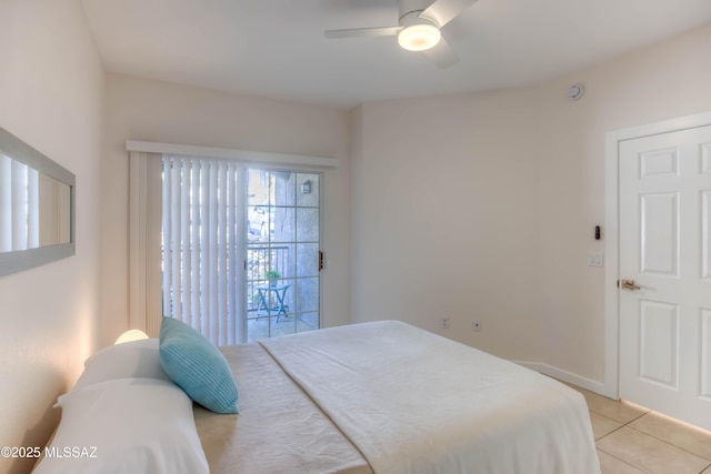 1500 E Pusch Wilderness Dr Unit 10106, Tucson, AZ 85737 - bedroom with light tile patterned flooring, ceiling fan, and access to exterior