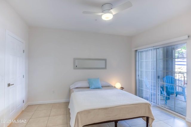 1500 E Pusch Wilderness Dr Unit 10106, Tucson, AZ 85737 - bedroom with light tile patterned floors, access to exterior, a ceiling fan, and baseboards