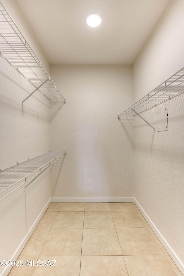 1500 E Pusch Wilderness Dr Unit 10106, Tucson, AZ 85737 - spacious closet with light tile patterned flooring