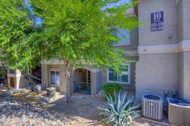 1500 E Pusch Wilderness Dr Unit 10106, Tucson, AZ 85737 - view of front of home with central AC and stucco siding