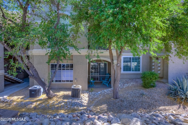 1500 E Pusch Wilderness Dr Unit 10106, Tucson, AZ 85737 - view of front of property with stucco siding and central air condition unit