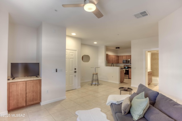 1500 E Pusch Wilderness Dr Unit 10106, Tucson, AZ 85737 - living room with light tile patterned flooring, ceiling fan, recessed lighting, and baseboards
