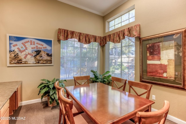 1500 E Pusch Wilderness Dr Unit 10106, Tucson, AZ 85737 - carpeted dining room featuring baseboards and crown molding