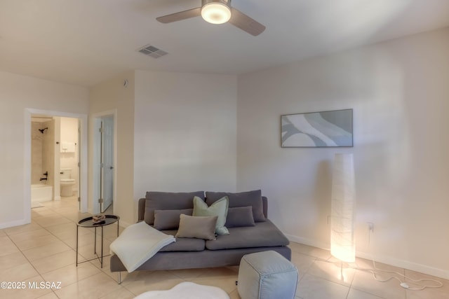 1500 E Pusch Wilderness Dr Unit 10106, Tucson, AZ 85737 - living room featuring a ceiling fan, light tile patterned floors, and baseboards