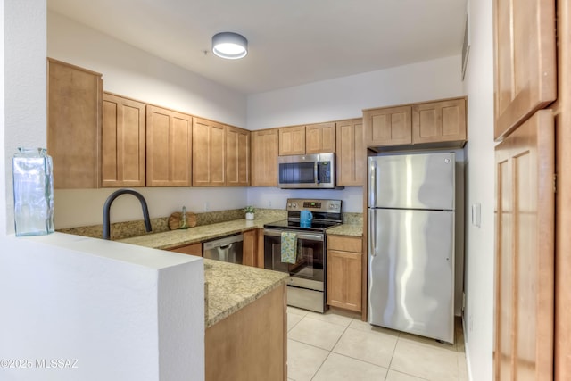 1500 E Pusch Wilderness Dr Unit 10106, Tucson, AZ 85737 - kitchen featuring stainless steel appliances, a peninsula, light tile patterned floors, light stone countertops, and a sink