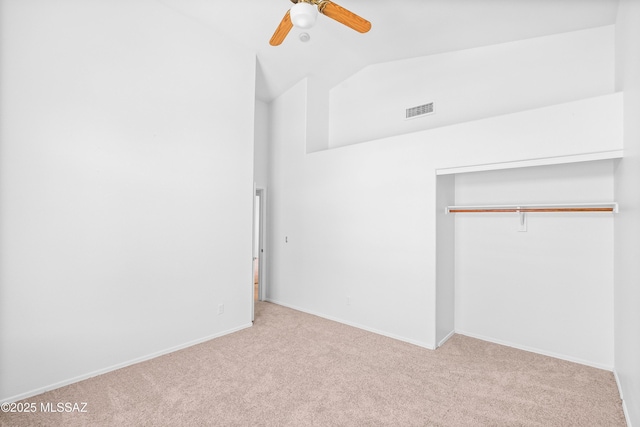 1562 W Via De Chapala, Sahuarita, AZ 85629 - unfurnished bedroom with carpet floors, vaulted ceiling, a closet, baseboards, and a ceiling fan