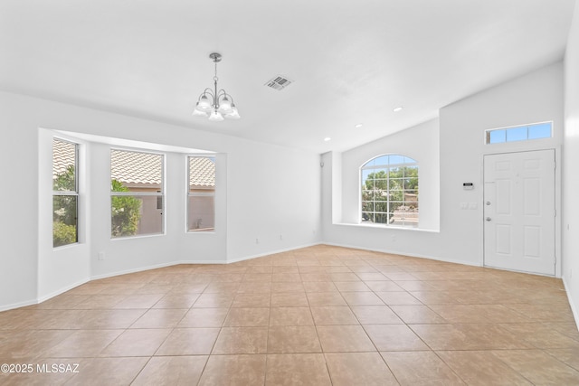 1562 W Via De Chapala, Sahuarita, AZ 85629 - foyer entrance featuring a chandelier, lofted ceiling, light tile patterned floors, and baseboards