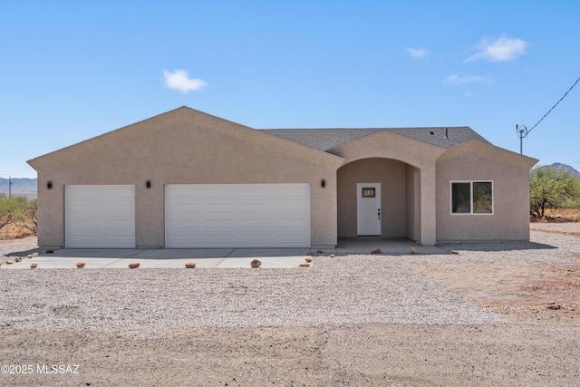 1844 Burns Ct, Rio Rico, AZ 85648 - view of front of property with stucco siding, an attached garage, and a shingled roof
