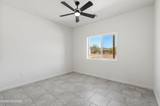 1844 Burns Ct, Rio Rico, AZ 85648 - unfurnished room with baseboards and a ceiling fan