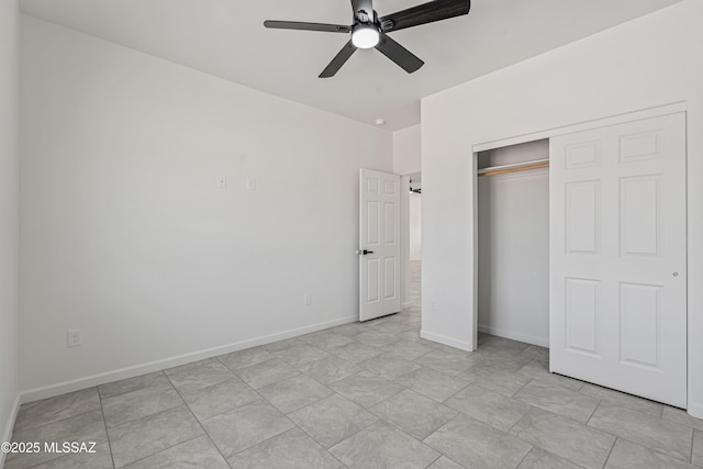 1844 Burns Ct, Rio Rico, AZ 85648 - unfurnished bedroom featuring a closet, baseboards, and ceiling fan