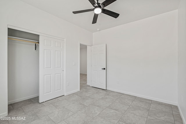 1844 Burns Ct, Rio Rico, AZ 85648 - unfurnished bedroom with baseboards, a closet, and ceiling fan