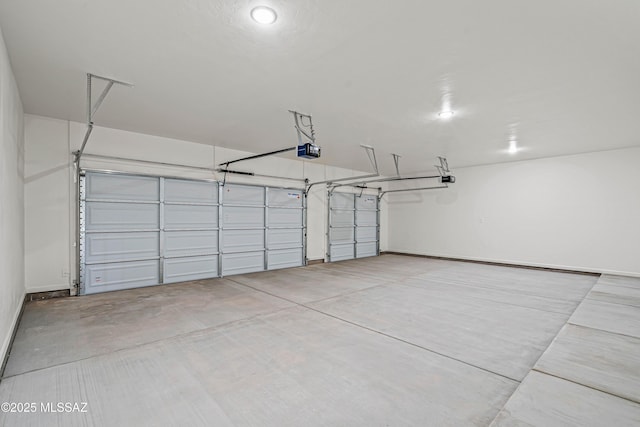 1844 Burns Ct, Rio Rico, AZ 85648 - garage featuring a garage door opener and baseboards