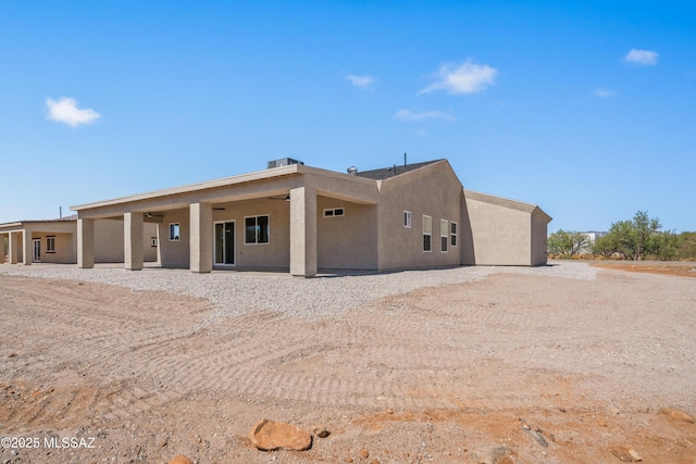 1844 Burns Ct, Rio Rico, AZ 85648 - back of property featuring stucco siding and a patio area
