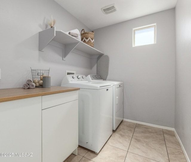 8751 W Saguaro Moon Rd, Marana, AZ 85653 - laundry room featuring independent washer and dryer, light tile patterned floors, and baseboards