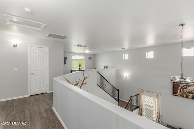 8751 W Saguaro Moon Rd, Marana, AZ 85653 - hall featuring an upstairs landing, wood finished floors, and baseboards