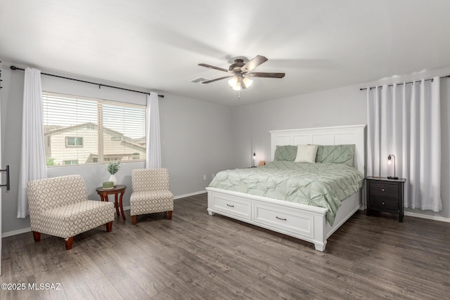 8751 W Saguaro Moon Rd, Marana, AZ 85653 - bedroom with dark wood finished floors, baseboards, and ceiling fan